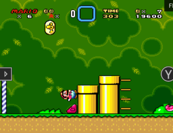 Mario running up yellow pipe